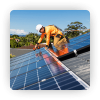 An experienced HP Energy installer expertly installing a solar panel system on a residential roof.