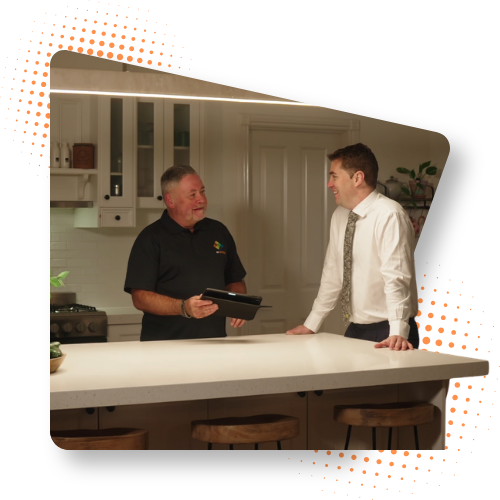 HP Energy consultant talking through upgrade options with a homeowner in his kitchen